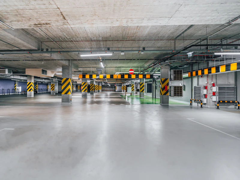 Exposed concrete slab above an open parking area